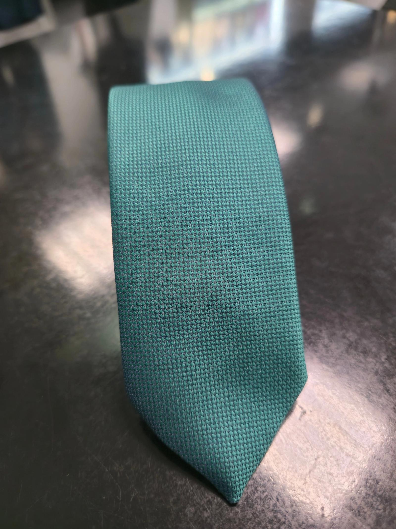 Viento textured teal green tie, vertical detail of woven texture