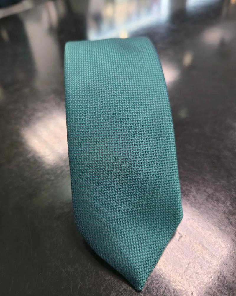Viento textured teal green tie, vertical detail of woven texture