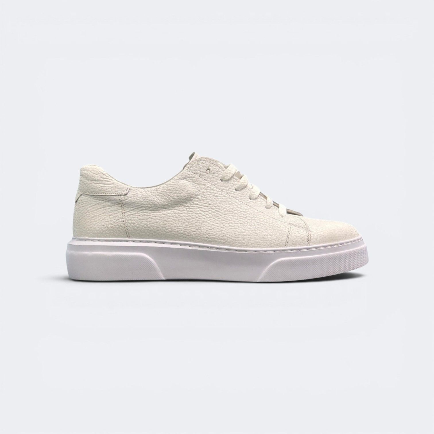 Viento cream leather sneaker, outer side profile on a white sole.