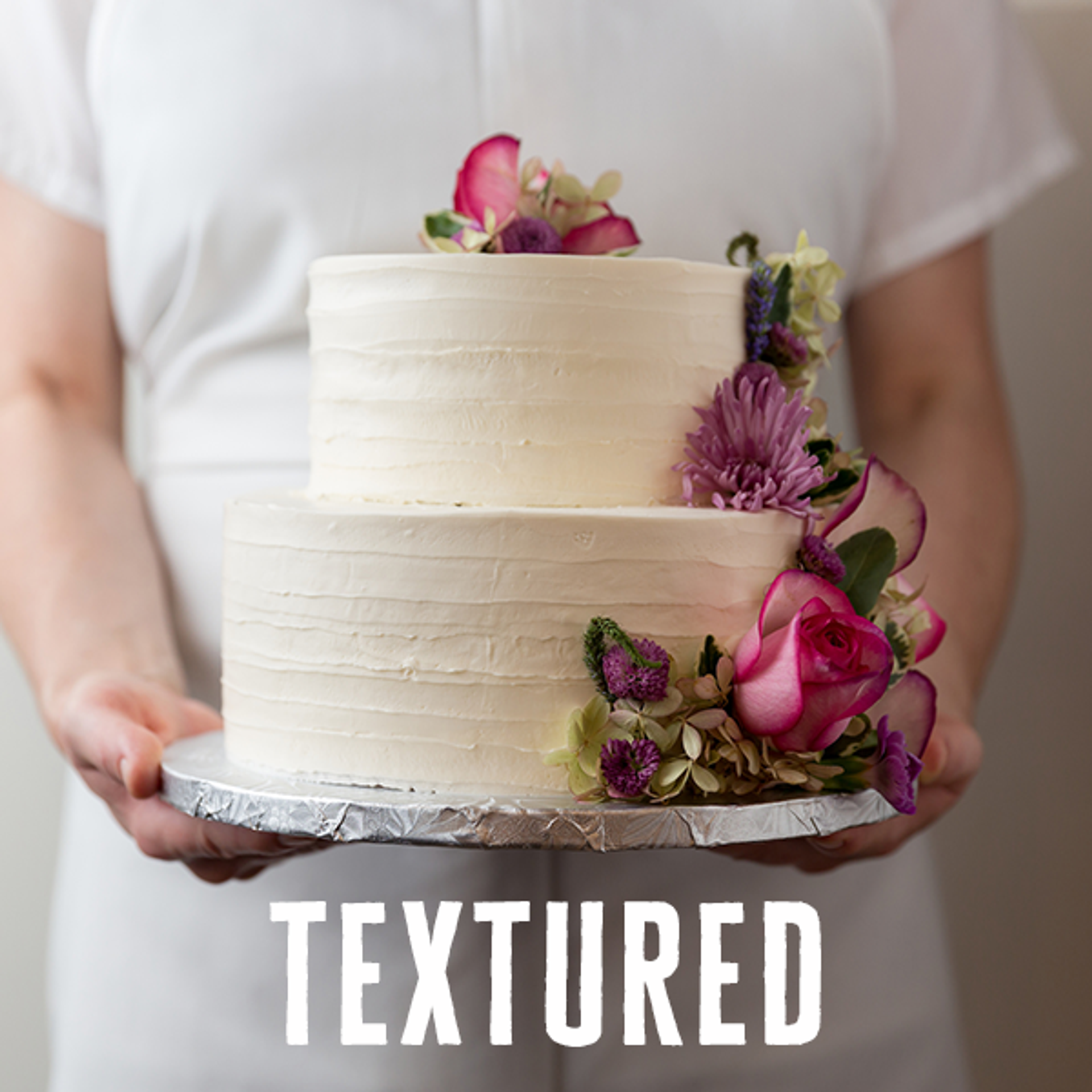 Wedding Cake with textured finished with pink flowers