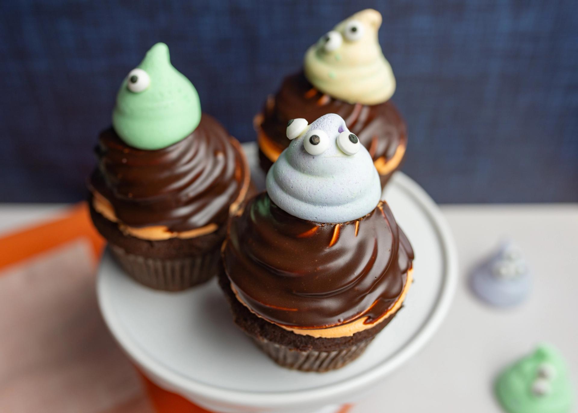 Chocolate Cupcakes with Orange  frosting and Chocolate glaze and Monster meringue on top