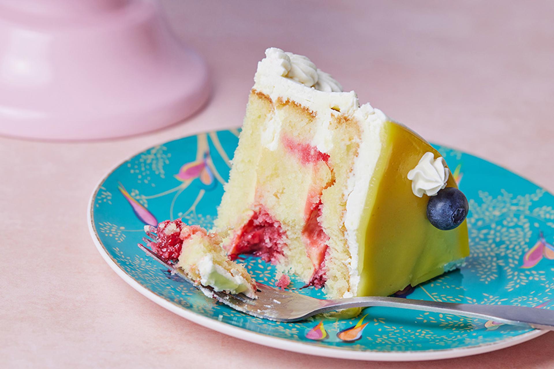 Slice of lemon raspberry cake on a plate