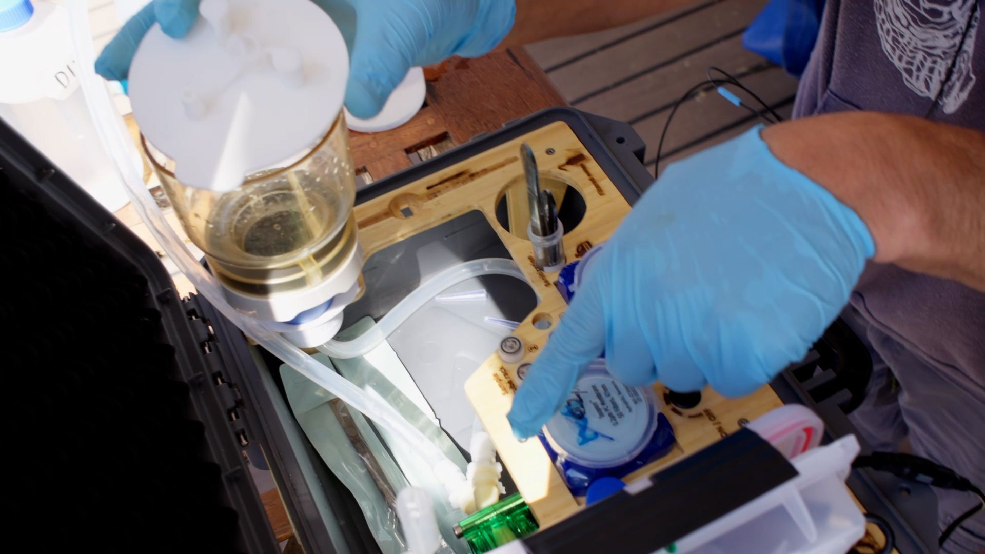 Emmanuel using the eDNA instrument. Photo: Matteo Baratella