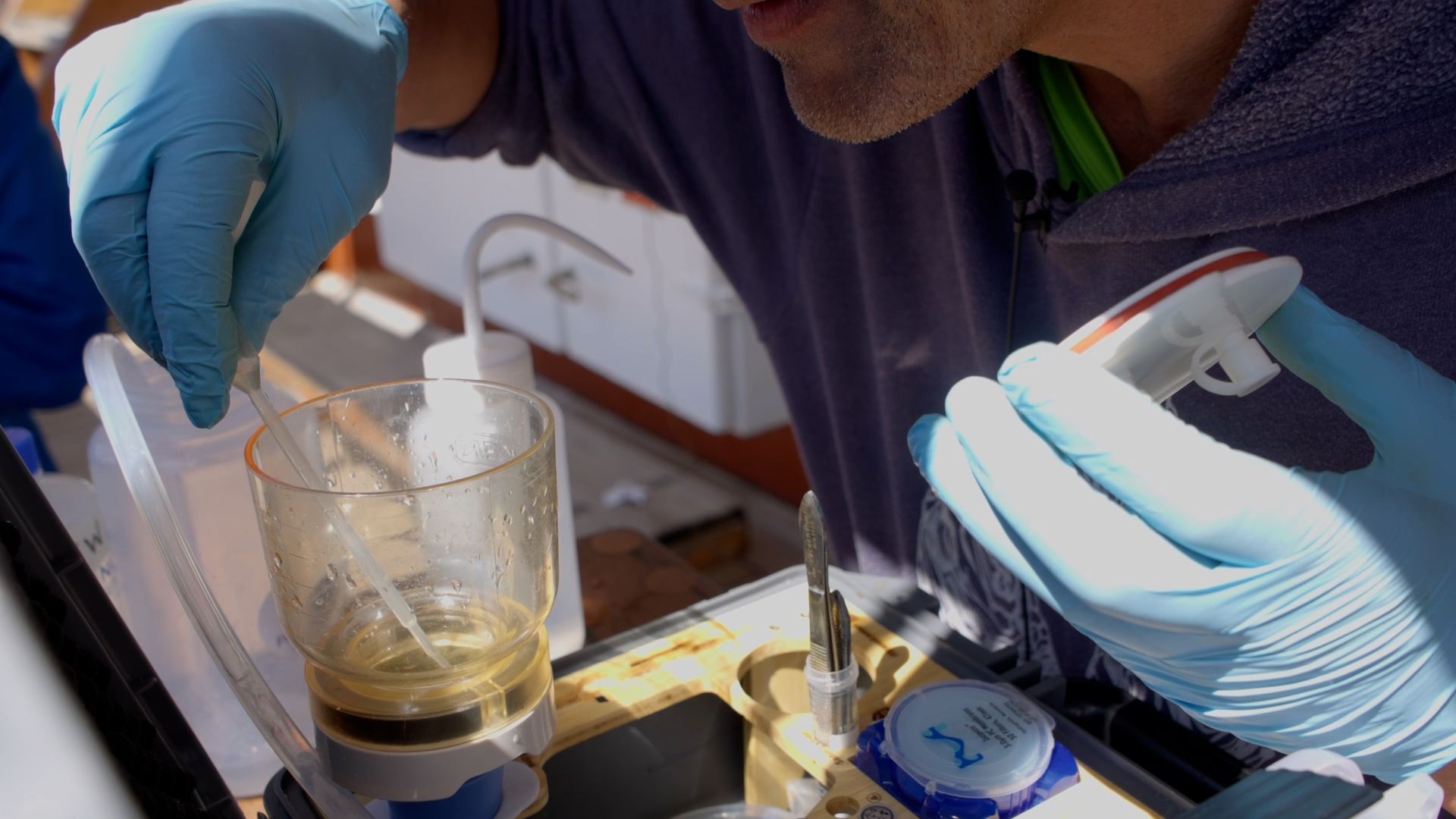 Emmanuel using the eDNA instrument. Photo: Matteo Baratella