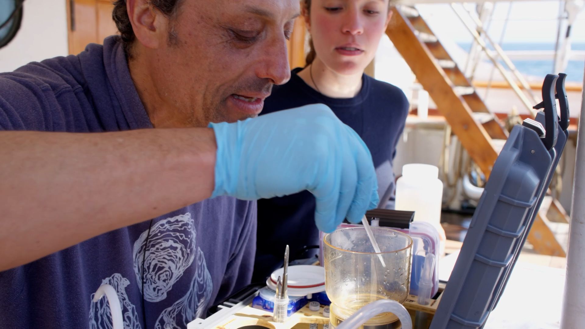 Emmanuel using the eDNA instrument. Photo: Matteo Baratella