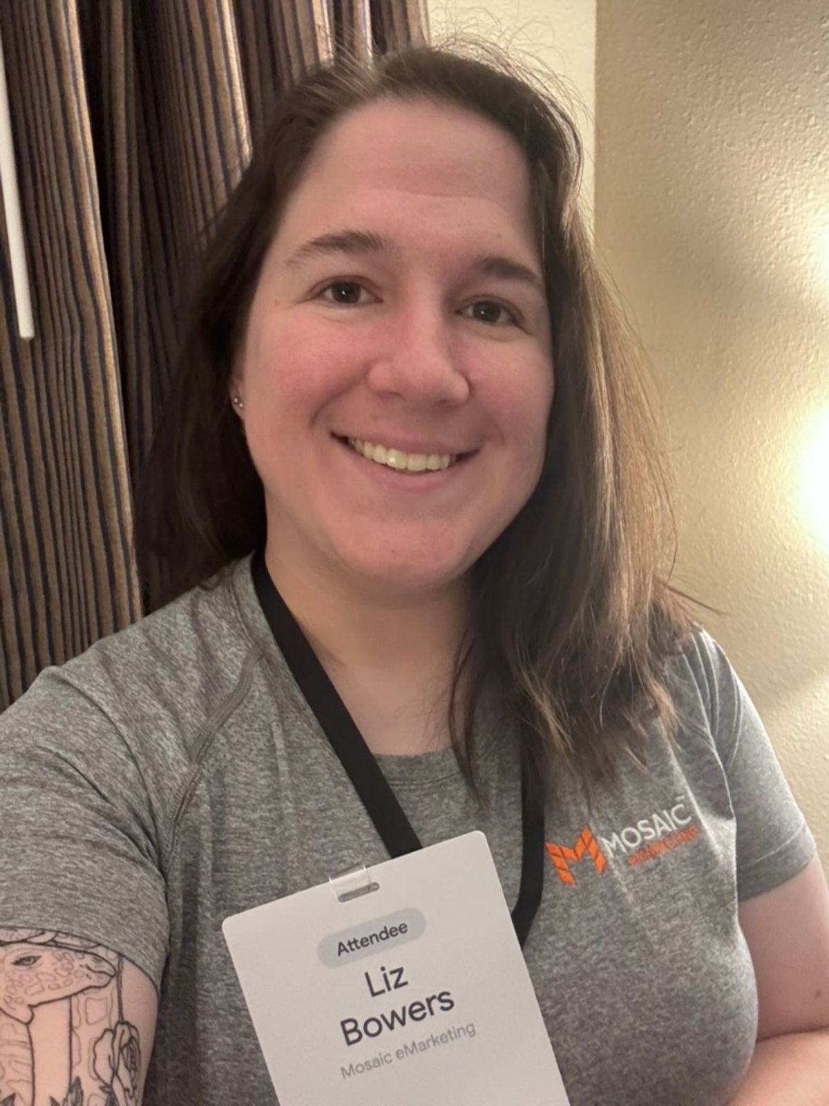 Liz Bowers showing her Google I/O badge