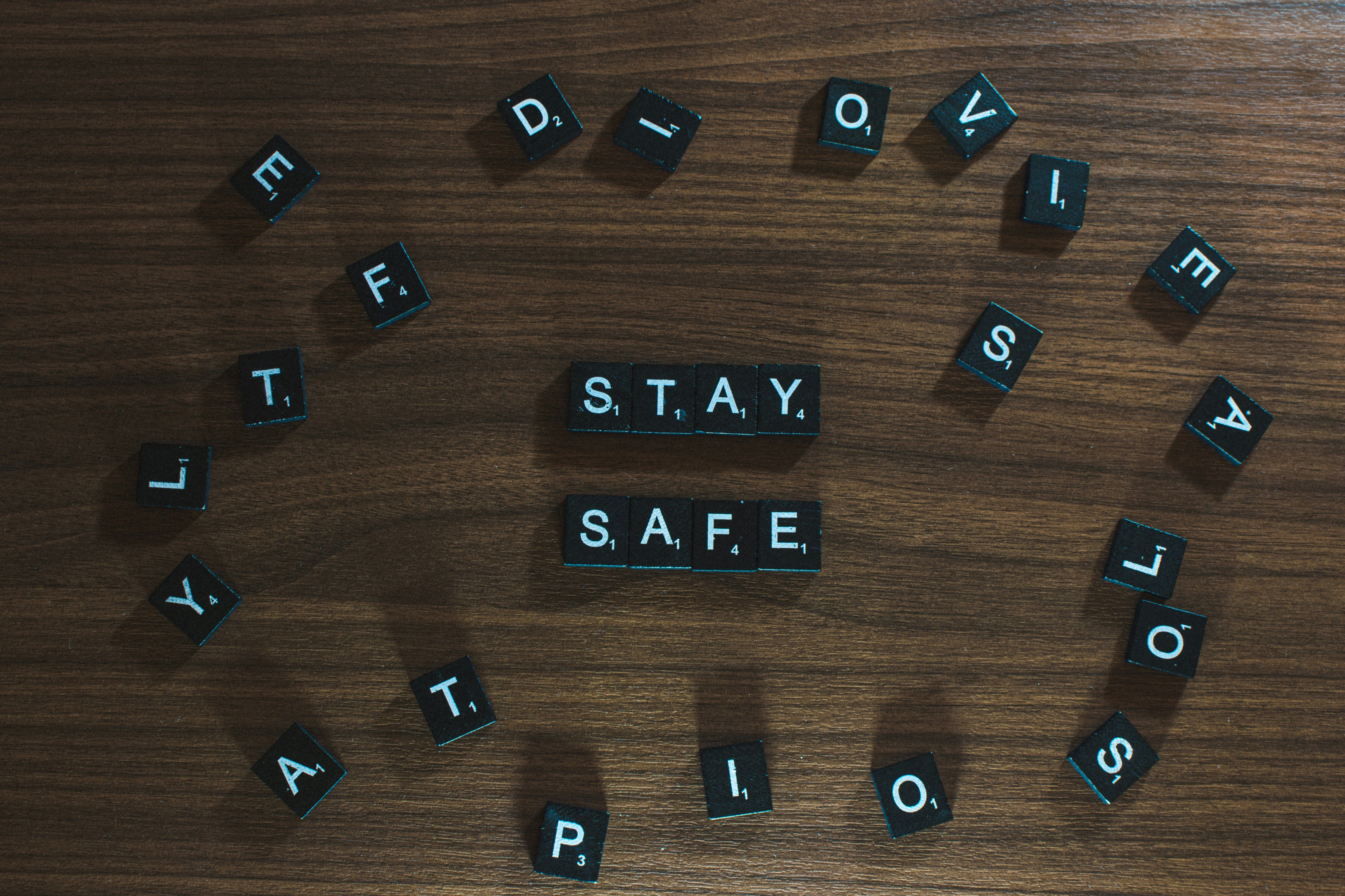 STAY SAFE' spelled with Scrabble tiles.