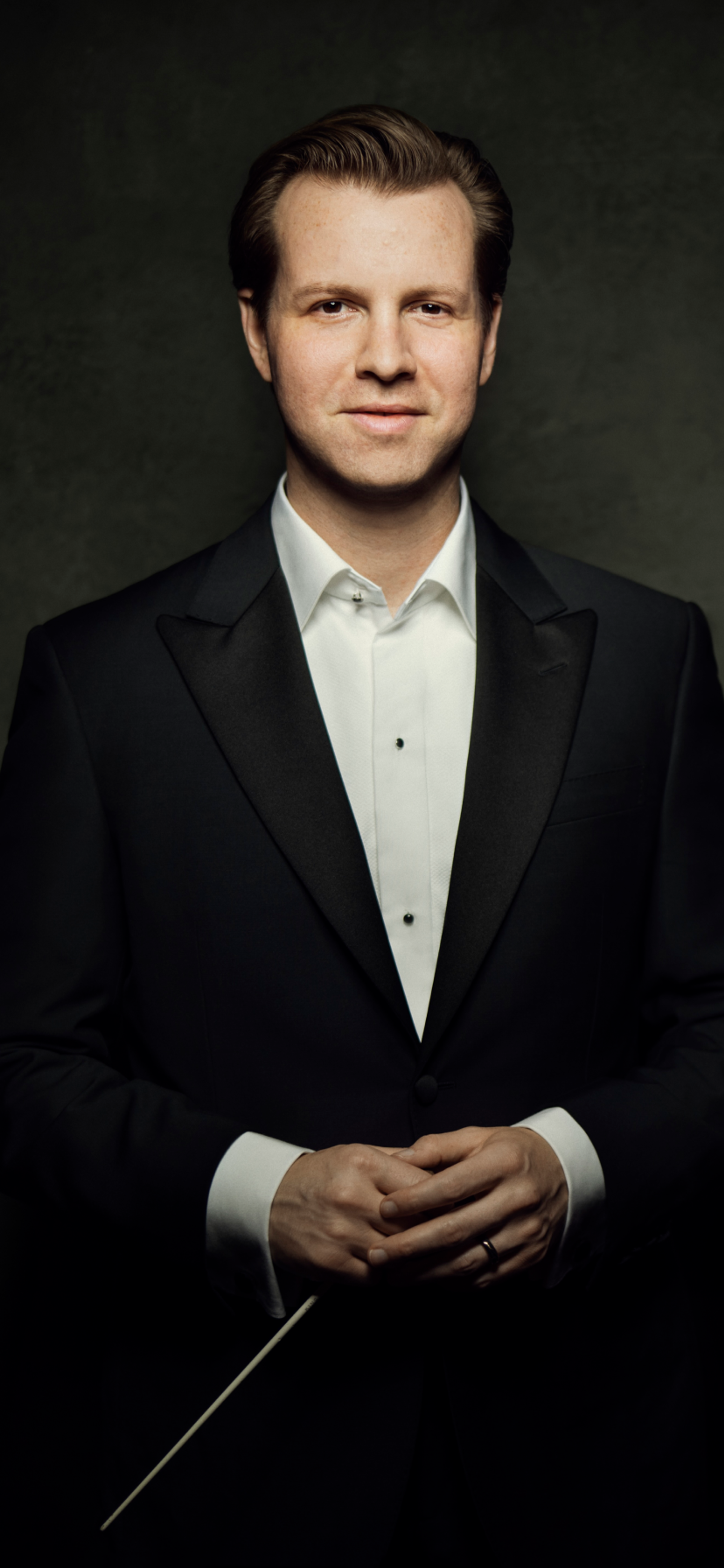 Tristan in tuxedo with baton 