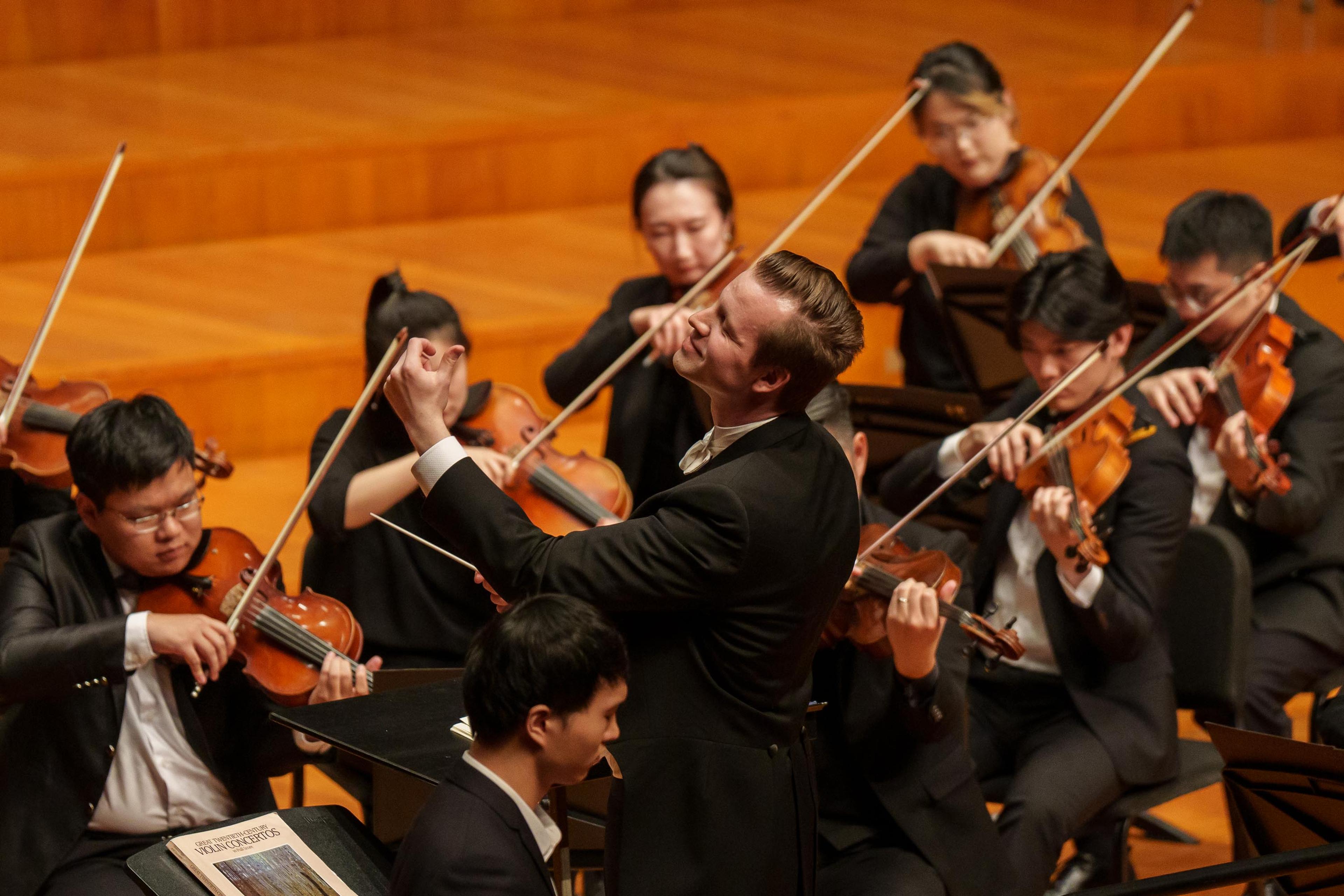 Tristan leading a concert at the NCPA for the GEML Violin Concerto Competitoin
