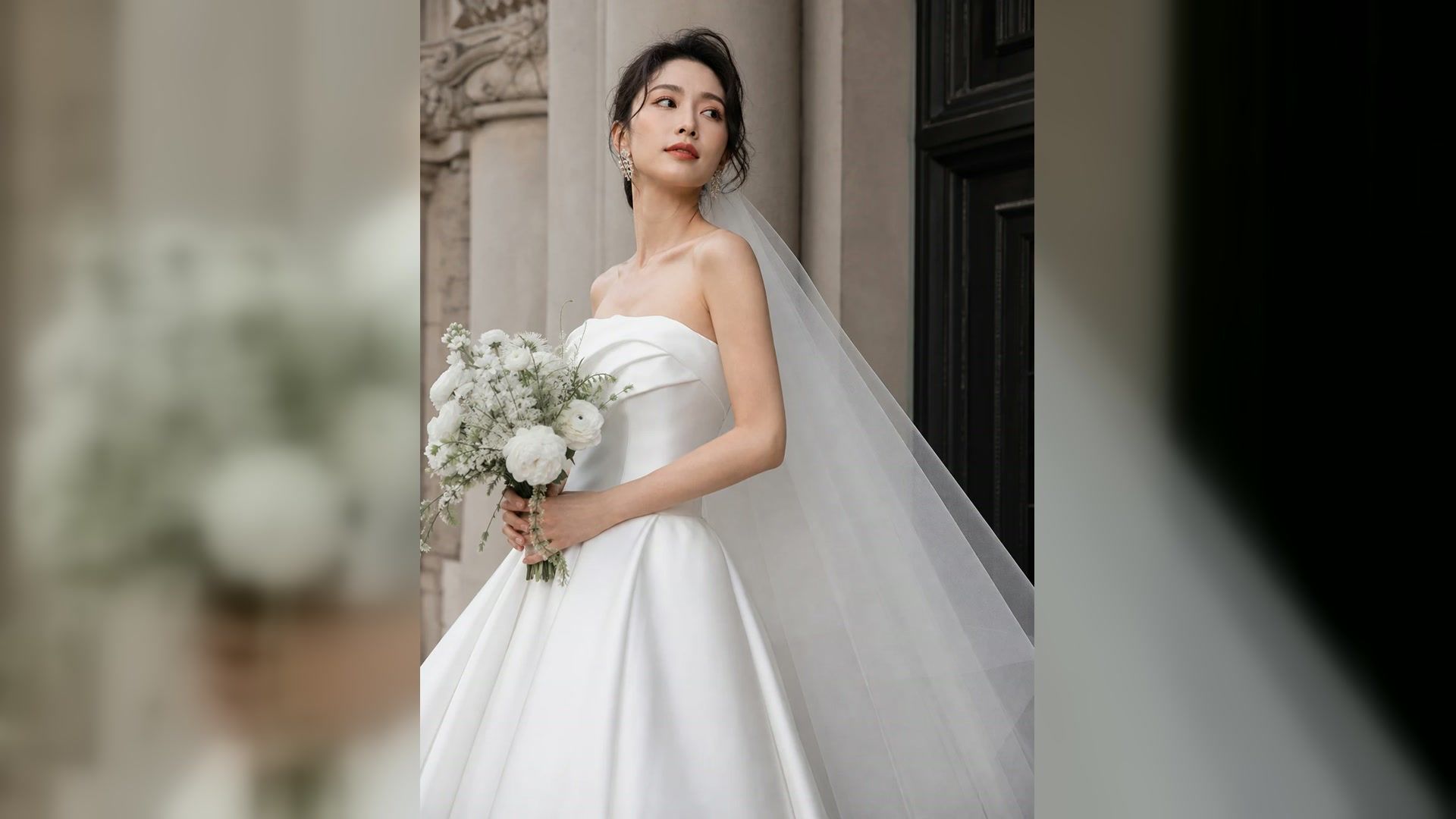 Bride holding a white bouquet in an editorial bridal portrait