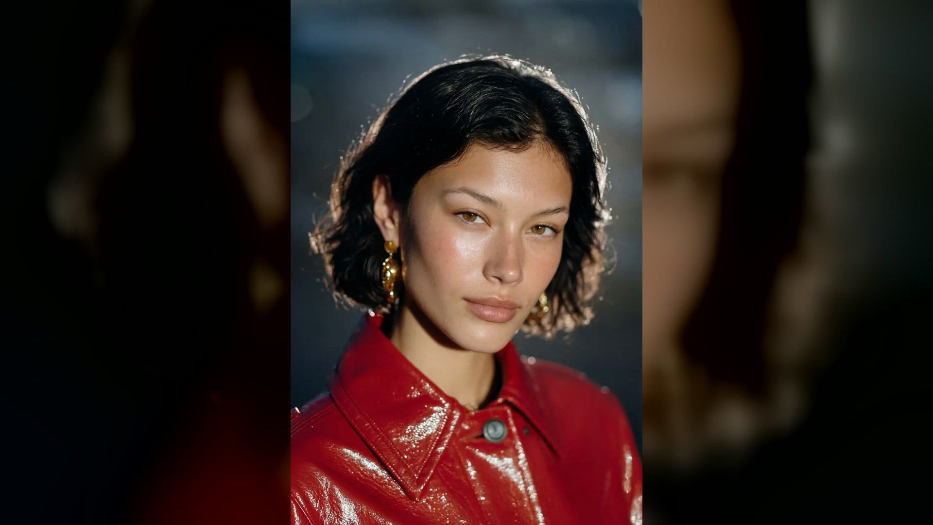 hard flash photography portrait with crisp detail and a red jacket
