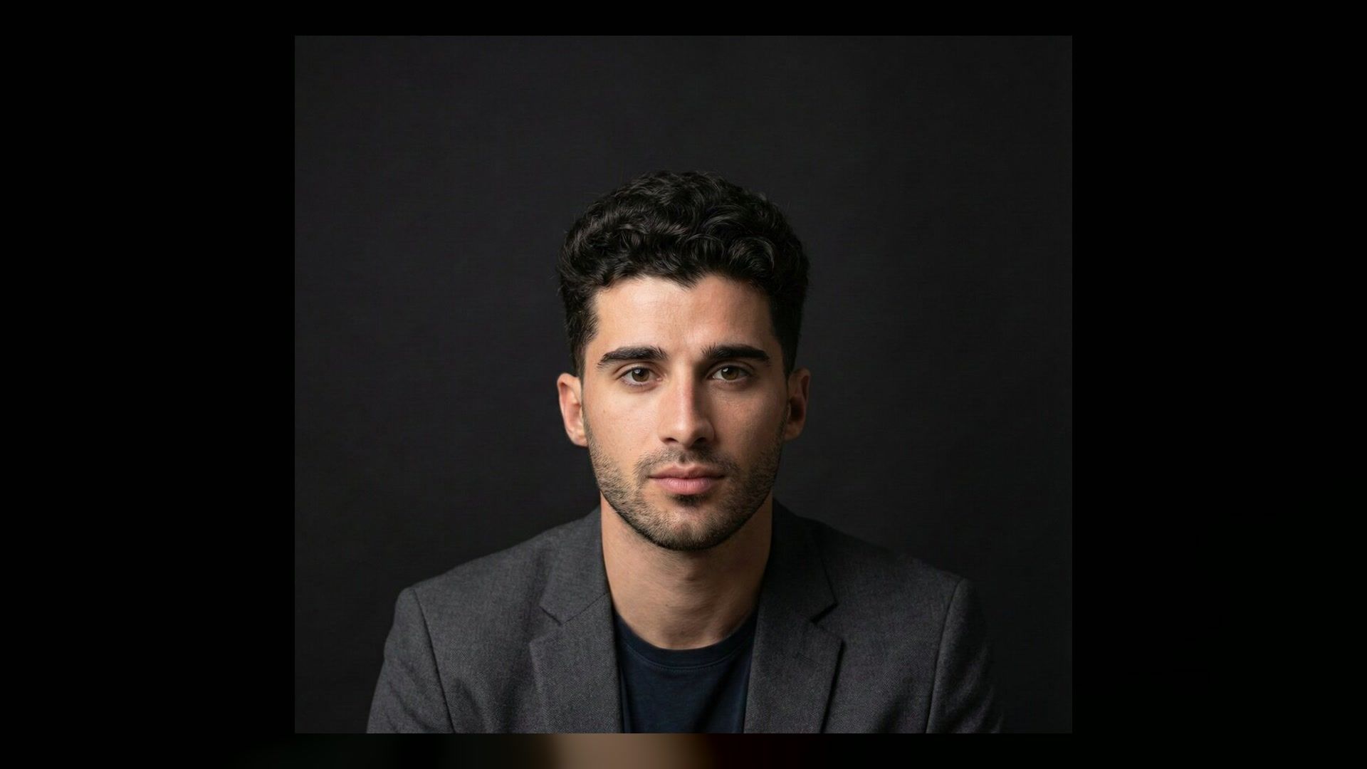 clean dark studio portrait for a DJ press photo concept
