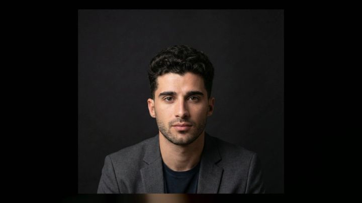 clean dark studio portrait for a DJ press photo concept