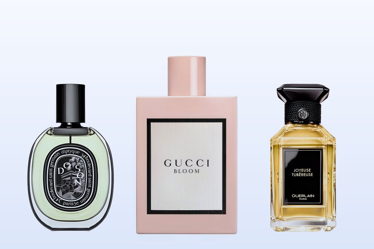 Do Son by Diptyque, Gucci Bloom and Joyeuse Tubéreuse by Guerlain on a pale blue background