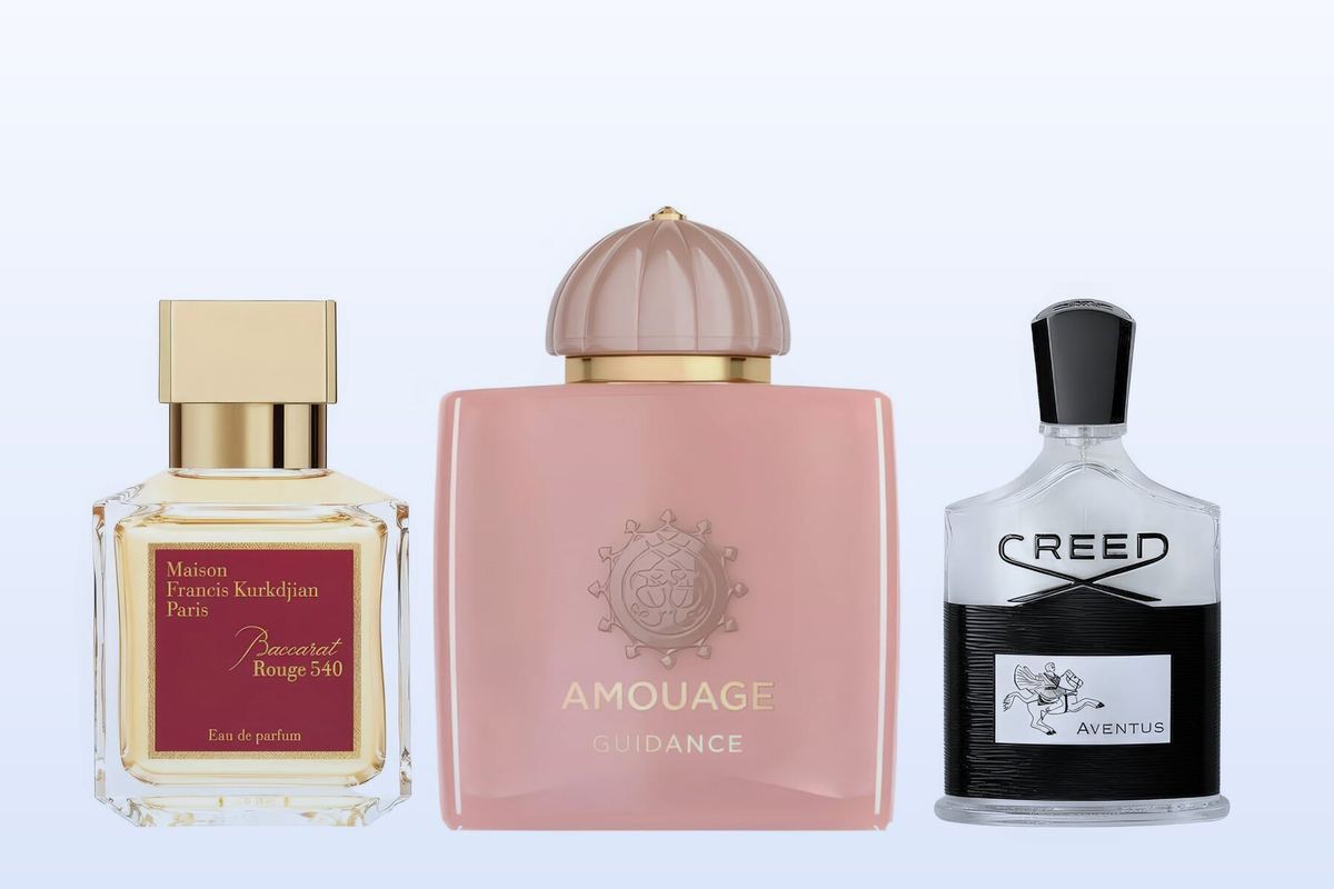 Three bottles on a pale blue background, Baccarat Rouge 540 by Maison Francis Kurkdjian, Guidance by Amouage and Aventus by Creed
