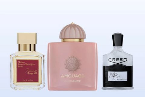 Three bottles on a pale blue background, Baccarat Rouge 540 by Maison Francis Kurkdjian, Guidance by Amouage and Aventus by Creed