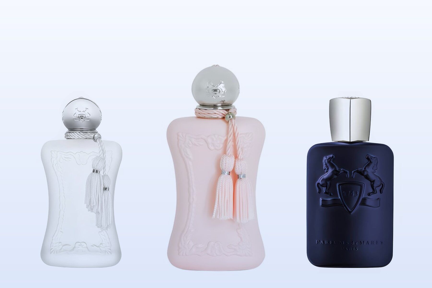 Three fragrance bottles, Valaya, Delina and Layton, on a pale blue background
