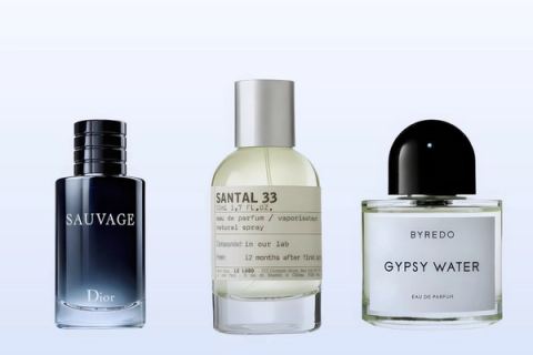 Three fragrance bottles, Sauvage, Santal 33 and Gypsy Water, on a pale blue background