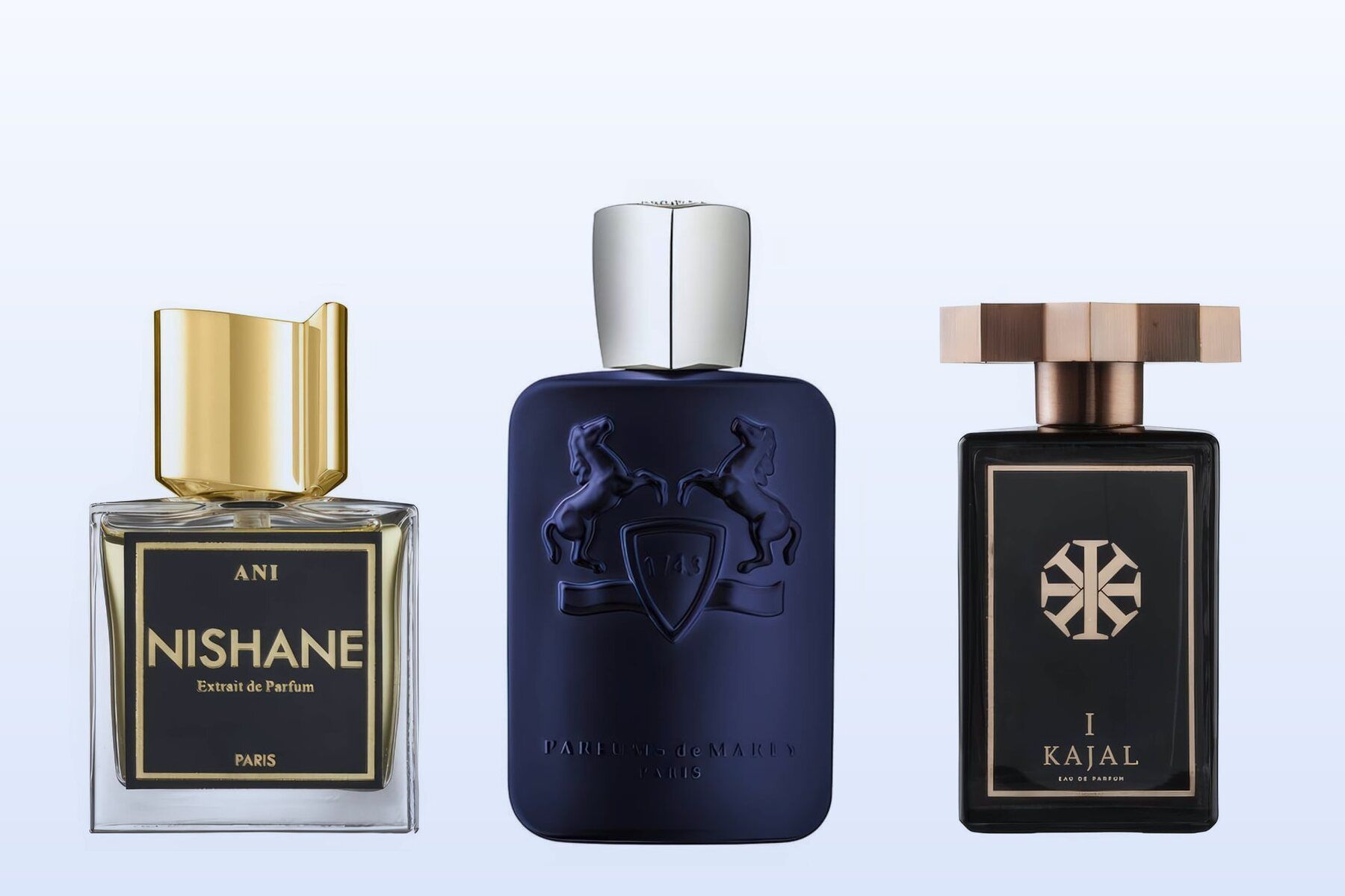 Three bottles on a pale blue background, Ani by Nishane, Layton by Parfums de Marly and Kajal Homme