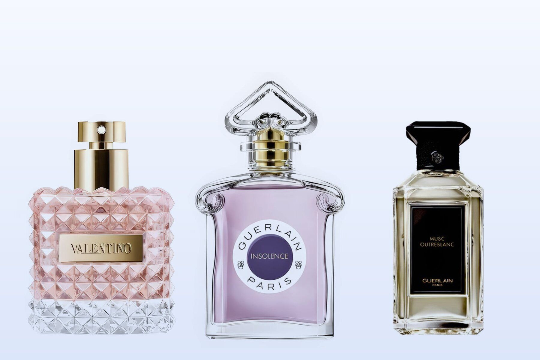 Valentino Donna, Guerlain Insolence Eau de Parfum and Guerlain Musc Outreblanc on a pale blue background
