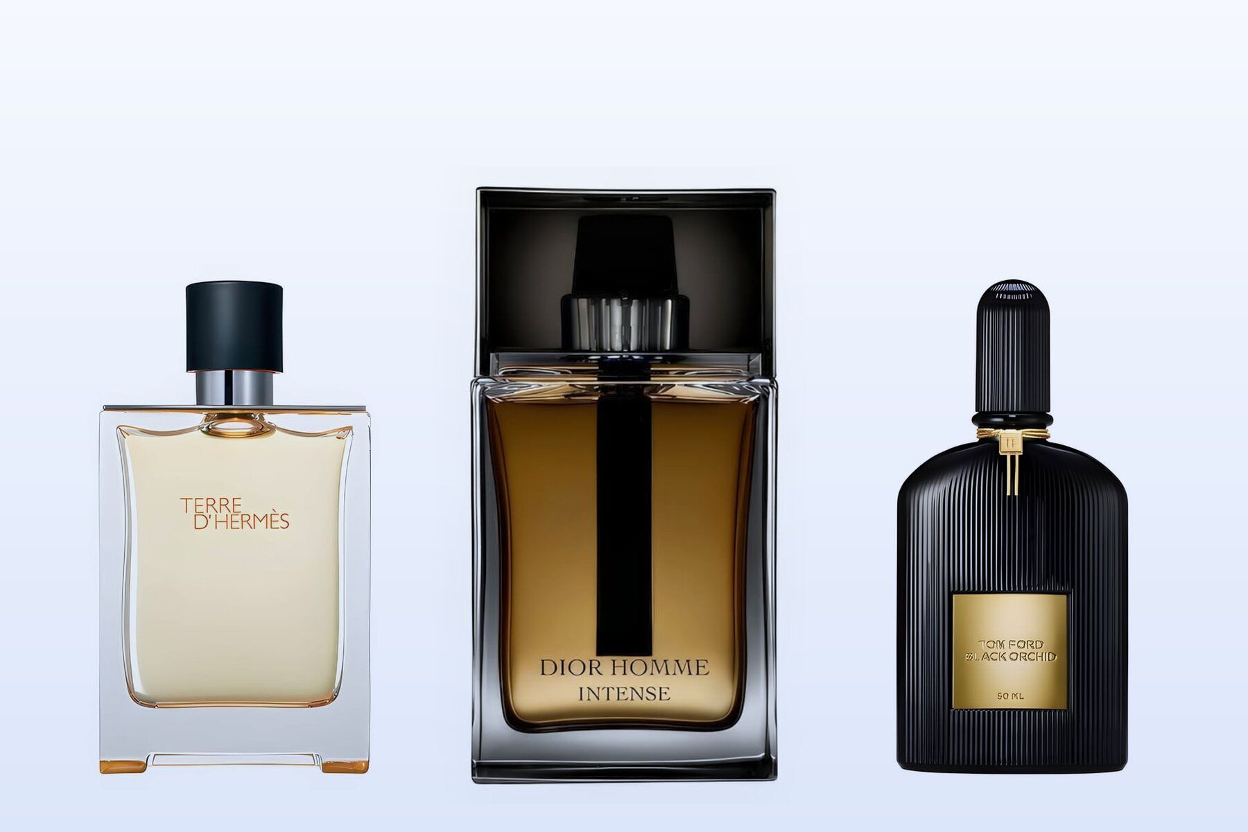 Τρία μπουκάλια αρωμάτων, Terre d'Hermès, Dior Homme Intense και Black Orchid, σε απαλό γαλάζιο φόντο