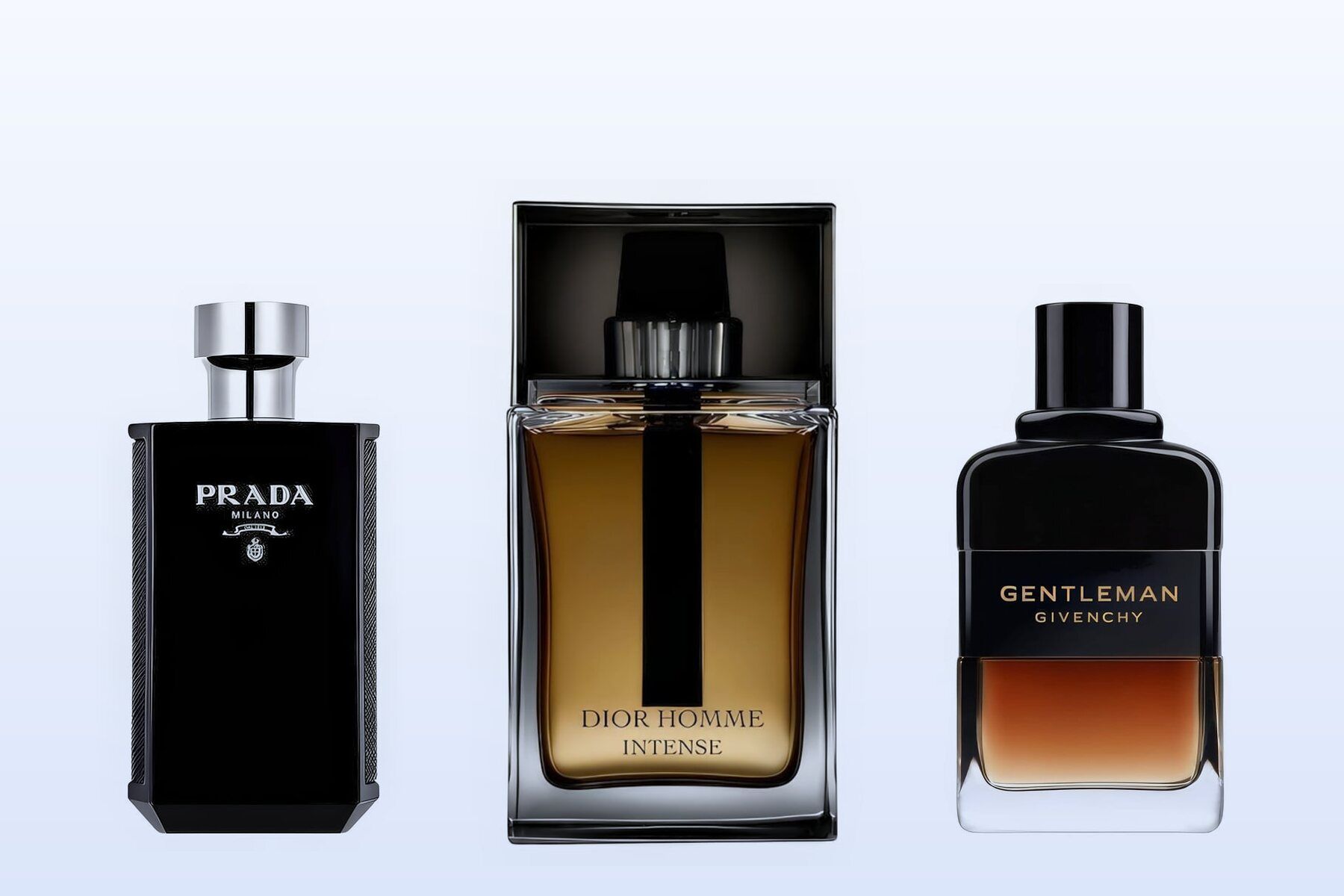 Three bottles on a pale blue background, Prada L'Homme Intense, Dior Homme Intense and Gentleman Eau de Parfum Reserve Privée