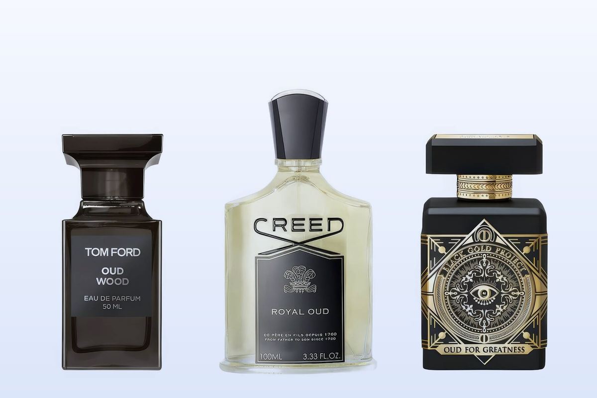 Oud Wood by Tom Ford, Royal Oud by Creed and Oud for Greatness by Initio Parfums Prives on a pale blue background