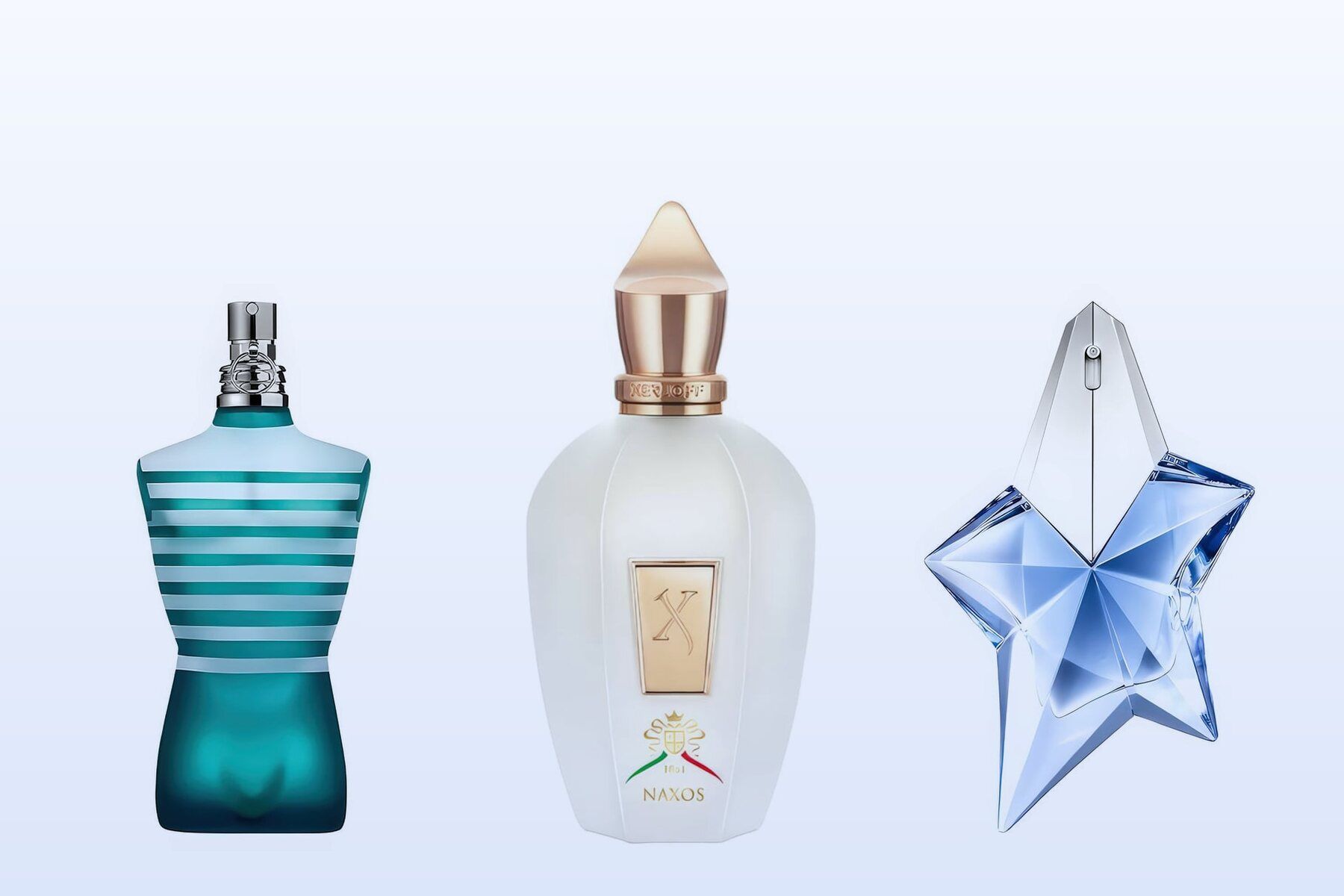 Three fragrance bottles, Le Male, XJ 1861 Naxos and Angel, on a pale blue background