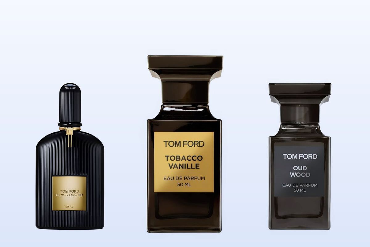 Three fragrance bottles, Black Orchid, Tobacco Vanille and Oud Wood, on a pale blue background