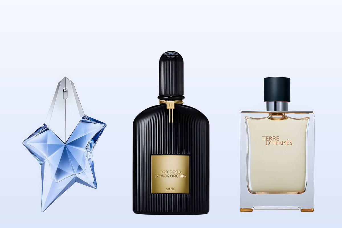 Three fragrance bottles, Angel, Black Orchid and Terre d'Hermès, on a pale blue background