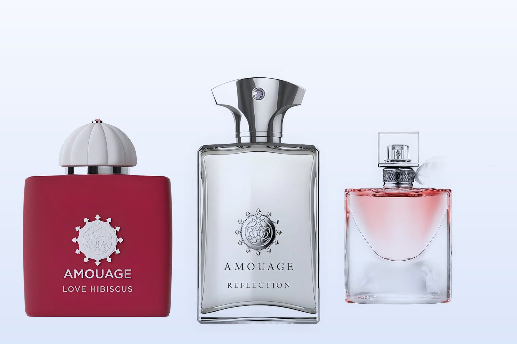 Three fragrance bottles, Love Hibiscus, Reflection Man and La Vie Est Belle, on a pale blue background