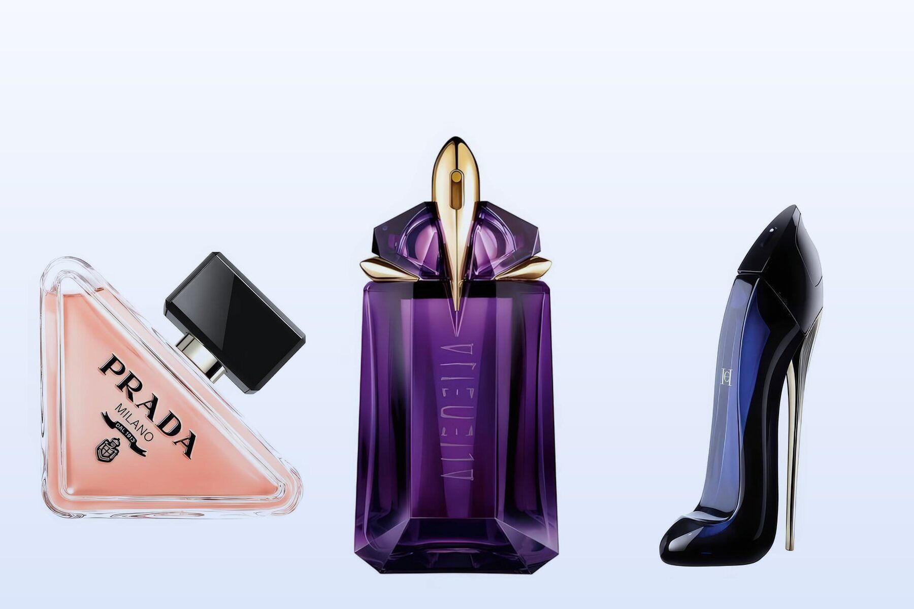 Three bottles on a pale blue background, Prada Paradoxe, Alien by Mugler and Good Girl by Carolina Herrera