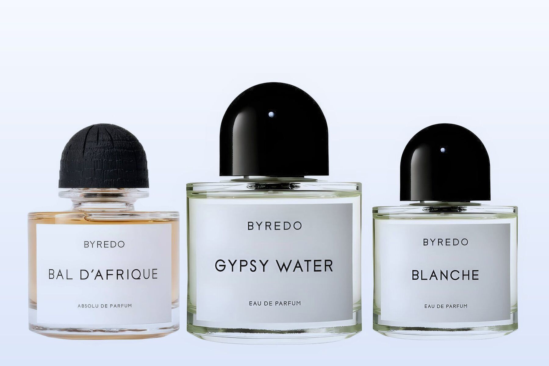 Three fragrance bottles, Bal d'Afrique Absolu, Gypsy Water and Blanche, on a pale blue background