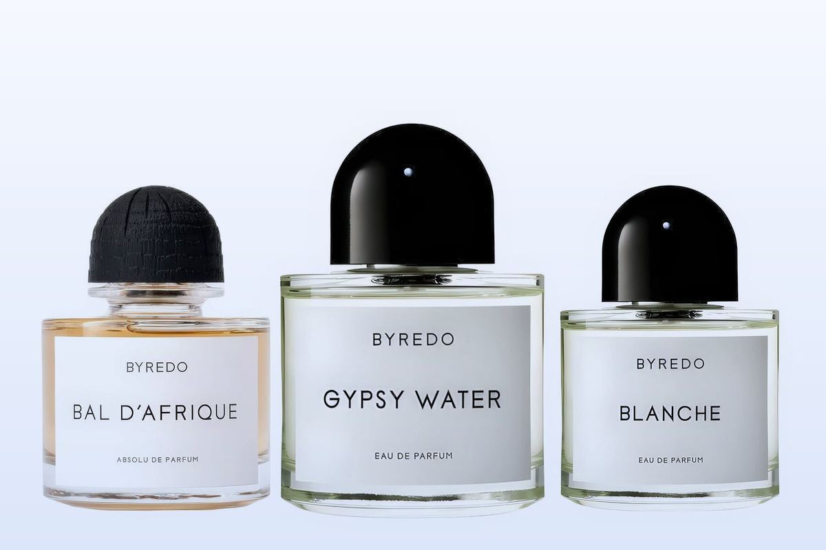 Three fragrance bottles, Bal d'Afrique Absolu, Gypsy Water and Blanche, on a pale blue background