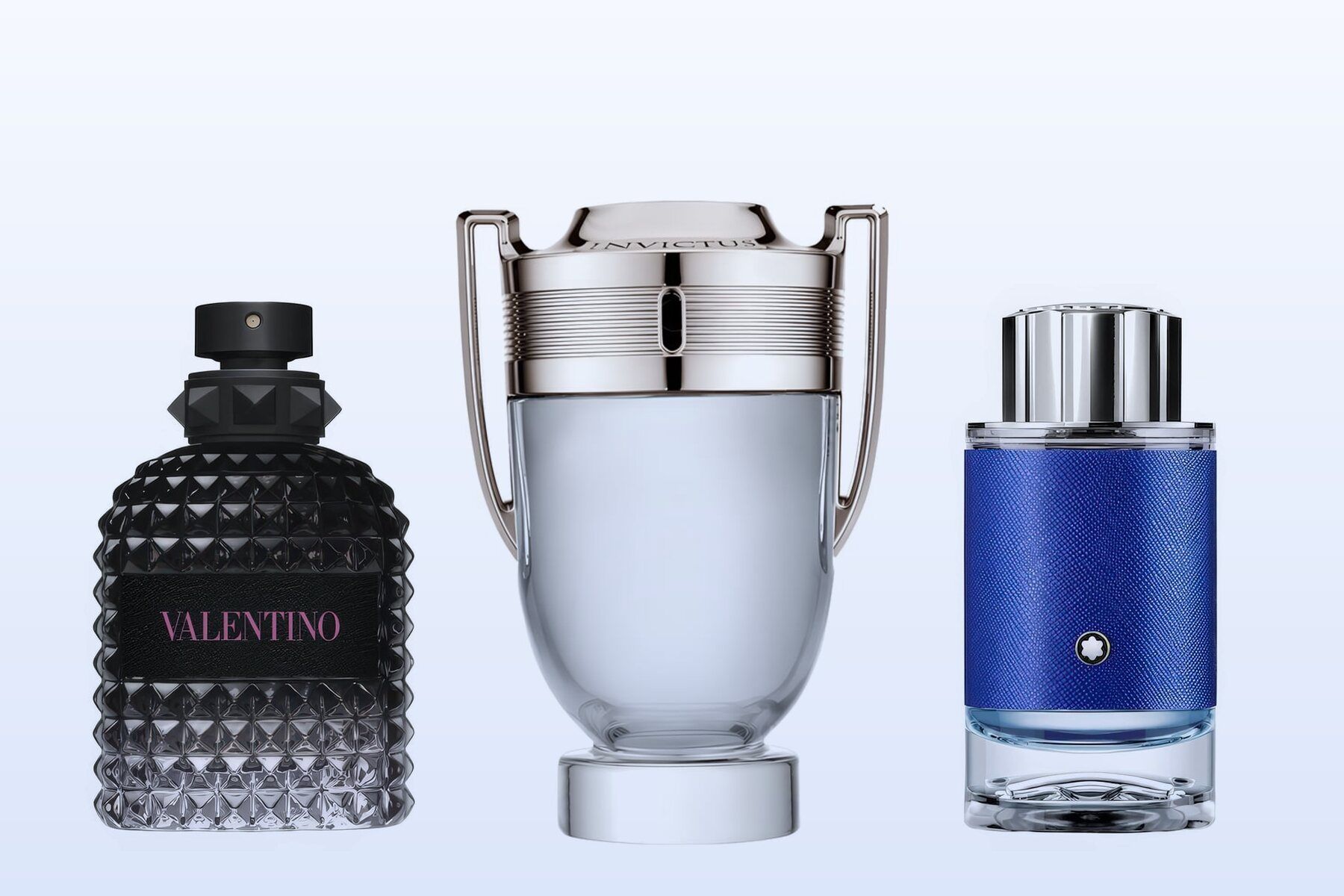Valentino Uomo Born in Roma, Rabanne Invictus Eau de Toilette and Montblanc Explorer Ultra Blue, three bottles on a pale blue background