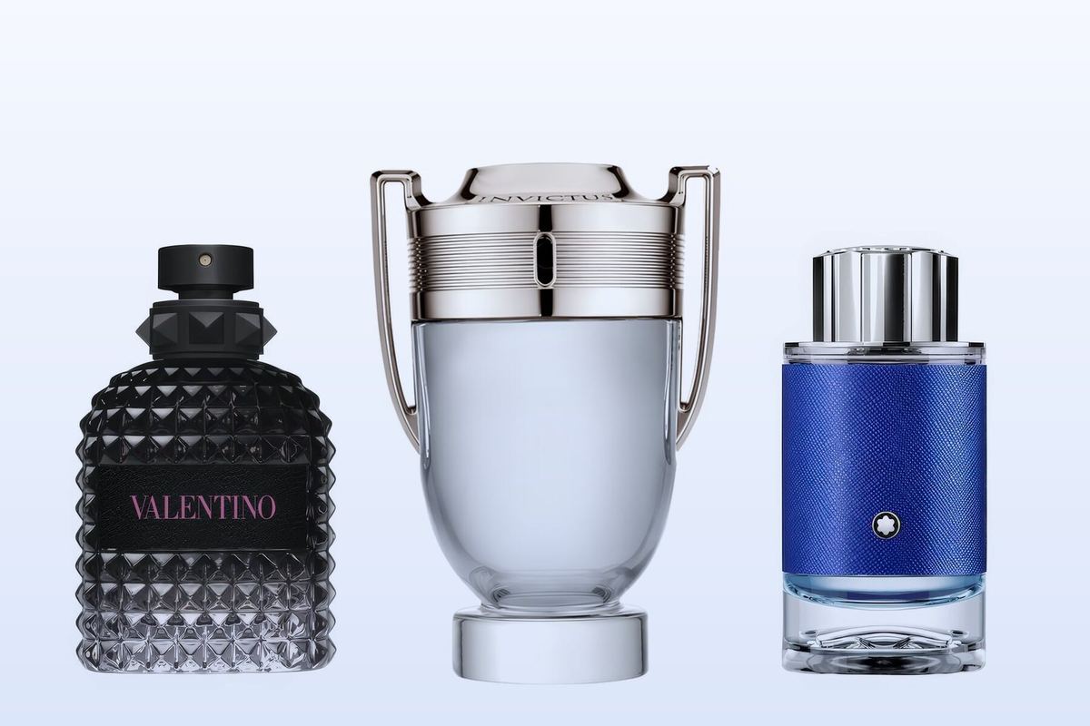 Valentino Uomo Born in Roma, Rabanne Invictus Eau de Toilette and Montblanc Explorer Ultra Blue, three bottles on a pale blue background