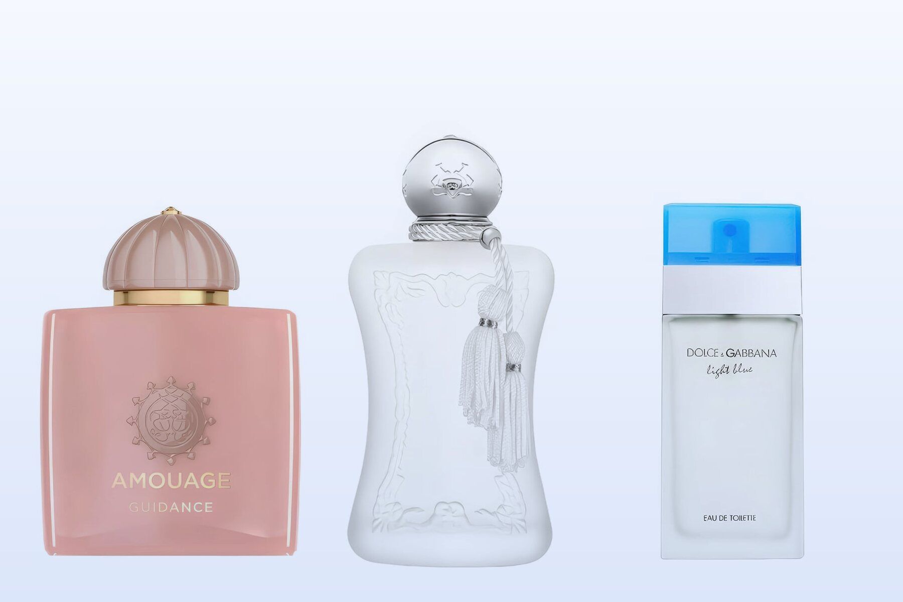 Three perfume bottles, Guidance, Valaya and Light Blue, on a pale blue background