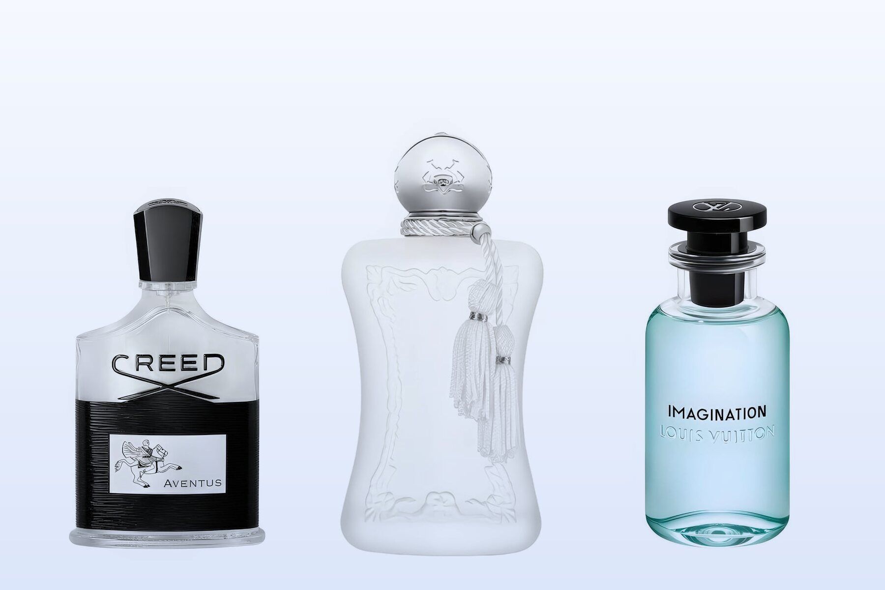 Three fragrance bottles, Aventus, Valaya and Imagination, on a pale blue background