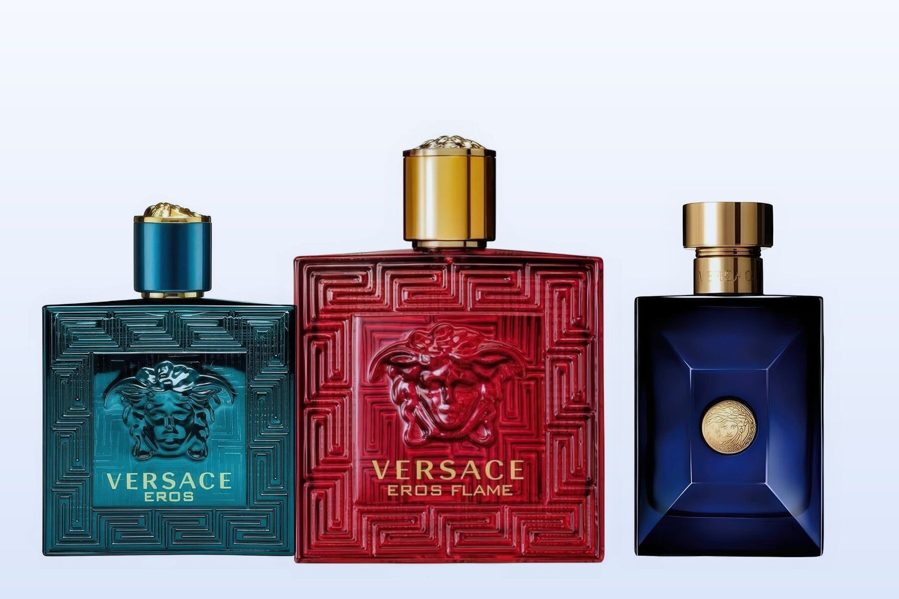 Three Versace bottles, Eros, Eros Flame and Dylan Blue, on a pale blue background