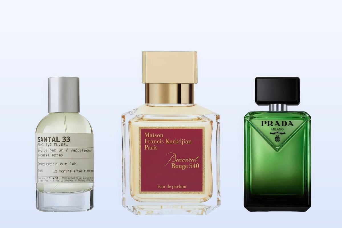 Three fragrance bottles, Santal 33, Baccarat Rouge 540 and Paradigme, on a pale blue background