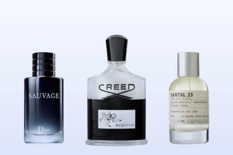 Three fragrance bottles, Sauvage, Aventus and Santal 33, on a pale blue background
