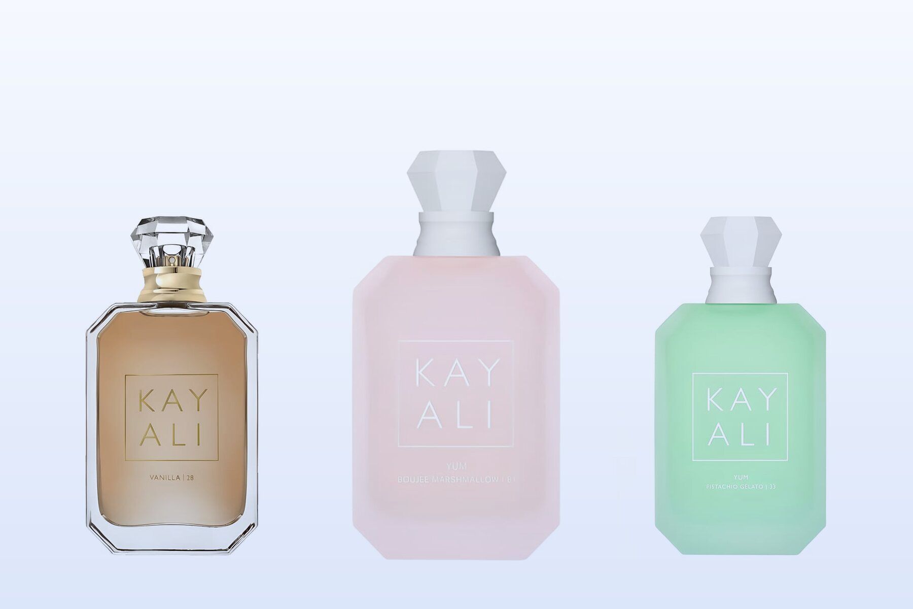 Kayali Vanilla 28, Yum Boujee Marshmallow 81 and Yum Pistachio Gelato 33 on a pale blue background