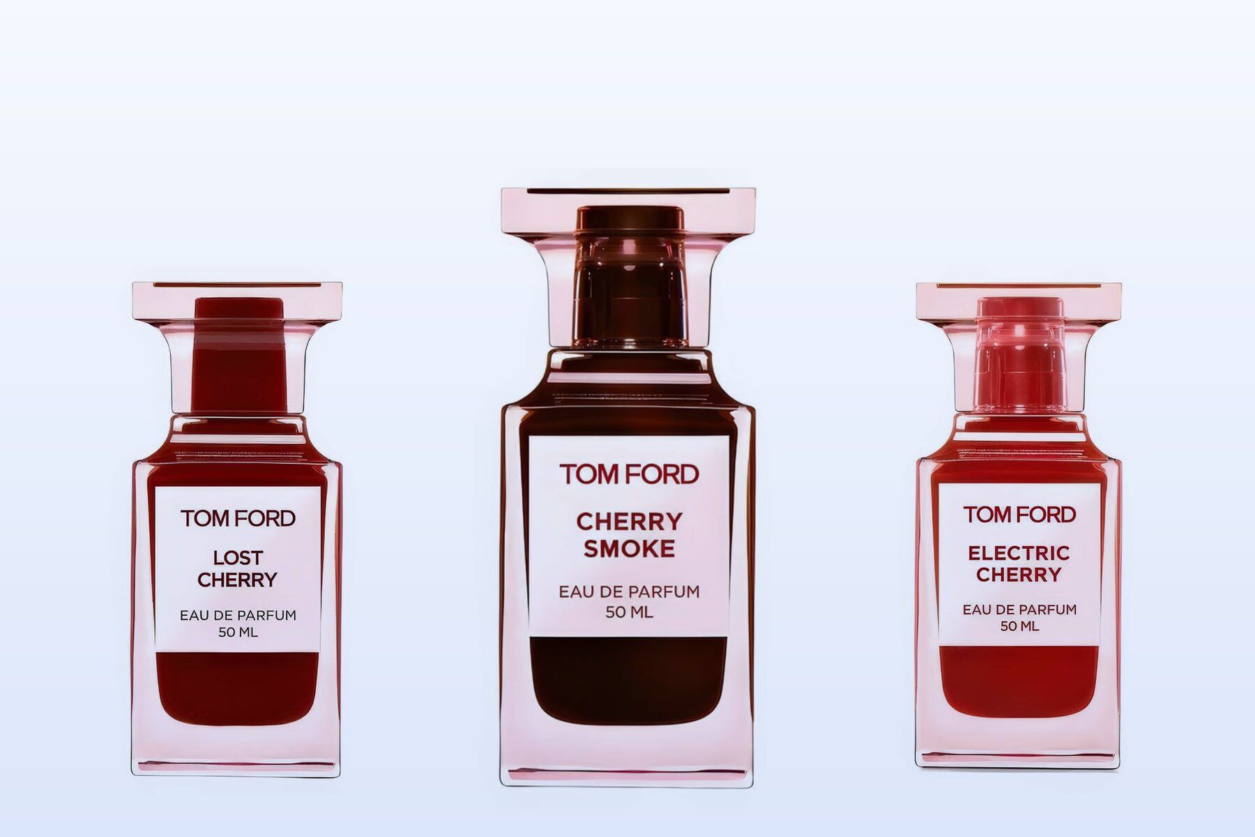 Tom Ford Lost Cherry, Cherry Smoke and Electric Cherry bottles on a pale blue background
