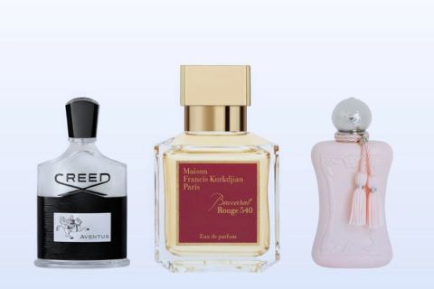 Three fragrance bottles, Aventus, Baccarat Rouge 540 and Delina, on a pale blue background