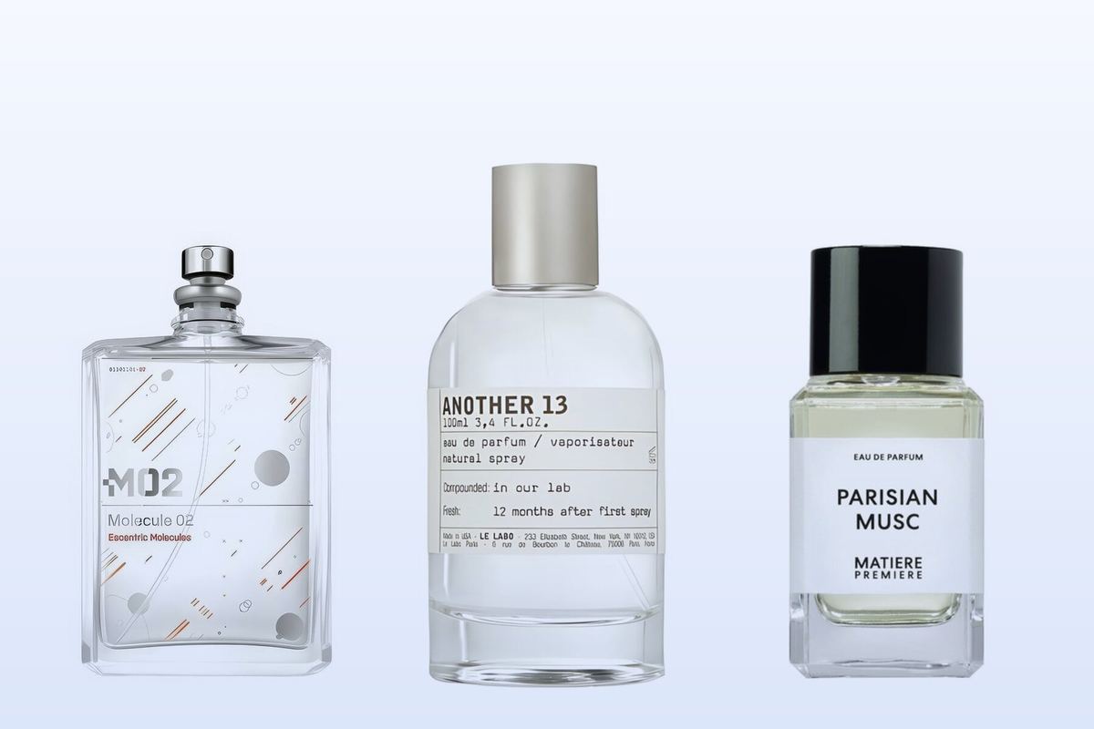 Three bottles on a pale blue background, Molecule 02 by Escentric Molecules, Another 13 by Le Labo and Parisian Musc by Matiere Premiere