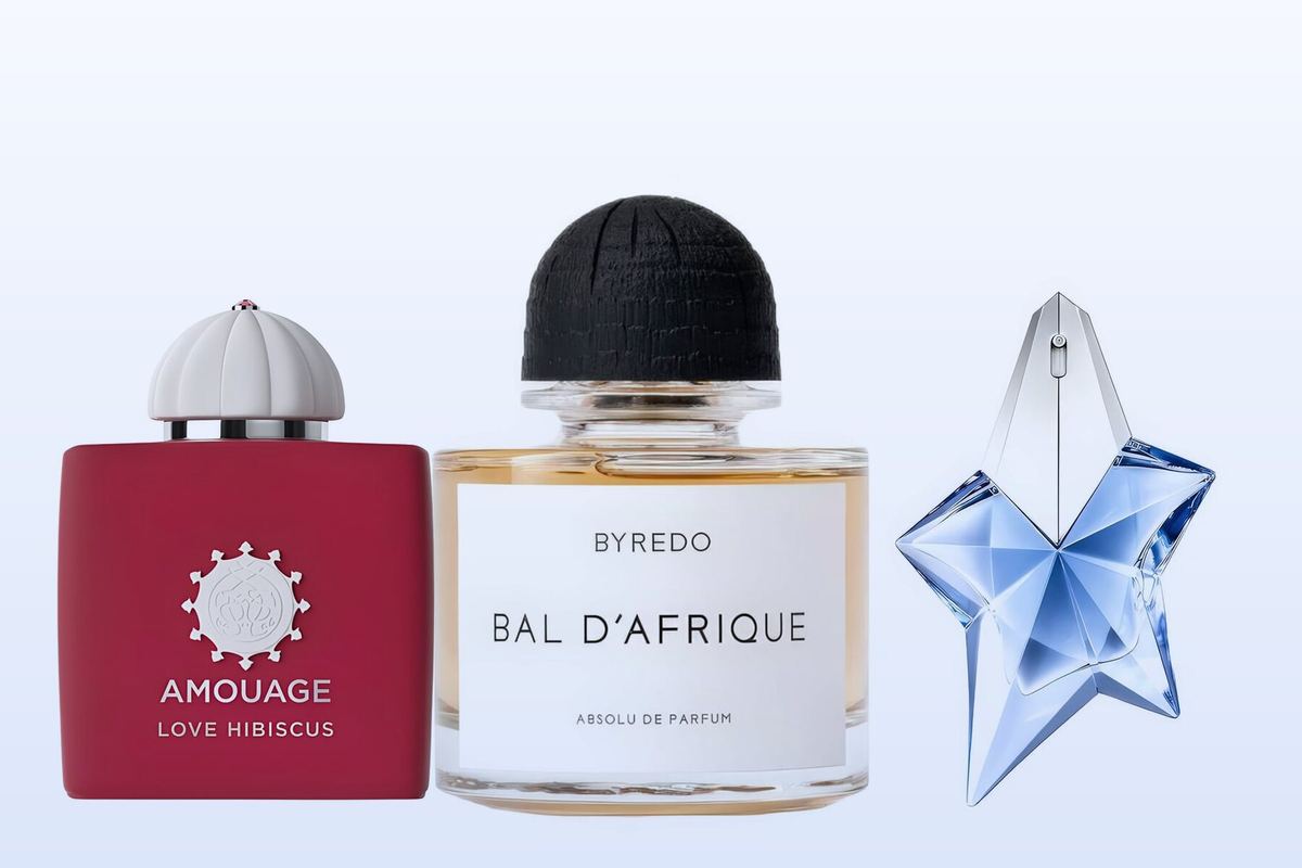 Three fragrance bottles, Love Hibiscus, Bal d'Afrique Absolu and Angel, on a pale blue background