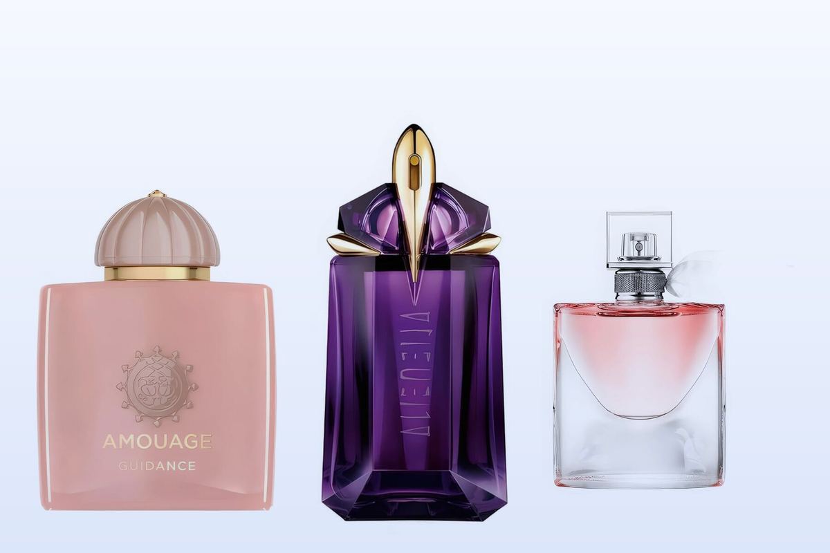 Three fragrance bottles, Guidance, Alien and La Vie Est Belle, on a pale blue background