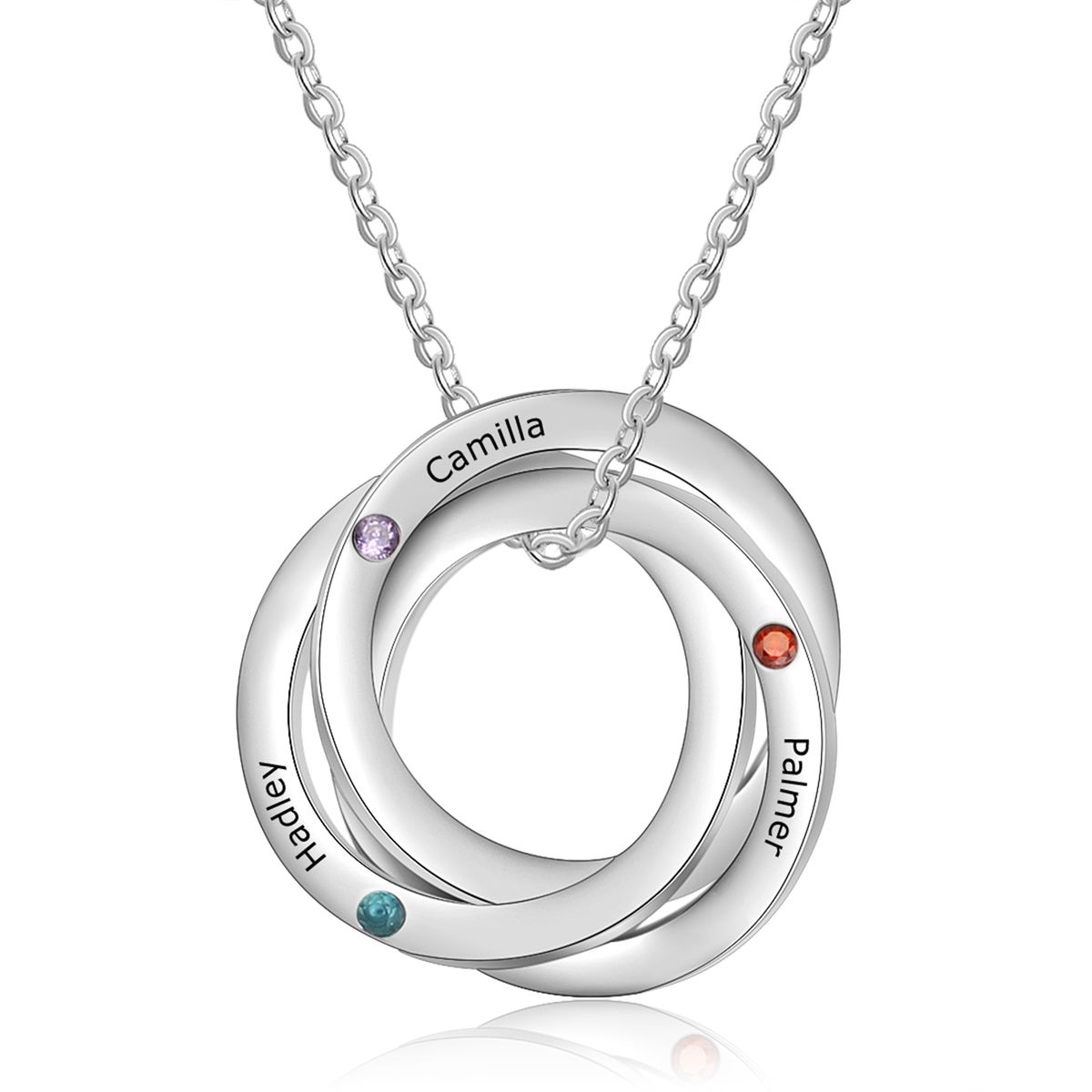 A Russian ring necklace with three interlocking rings set with birthstones — past, present and future