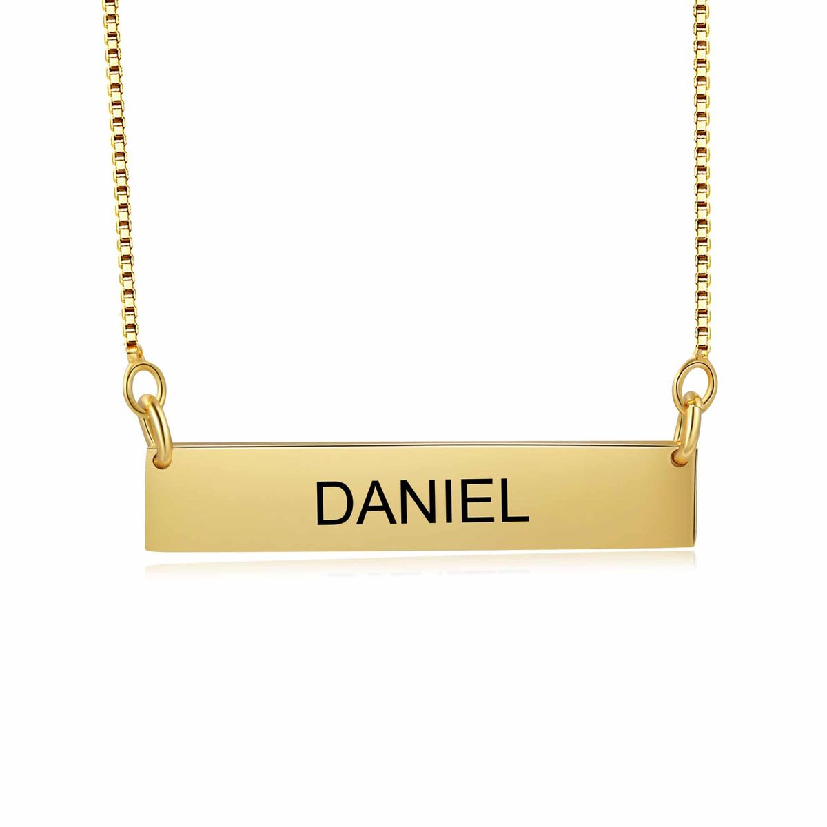 A minimalist engraved bar name necklace in gold — clean block lettering
