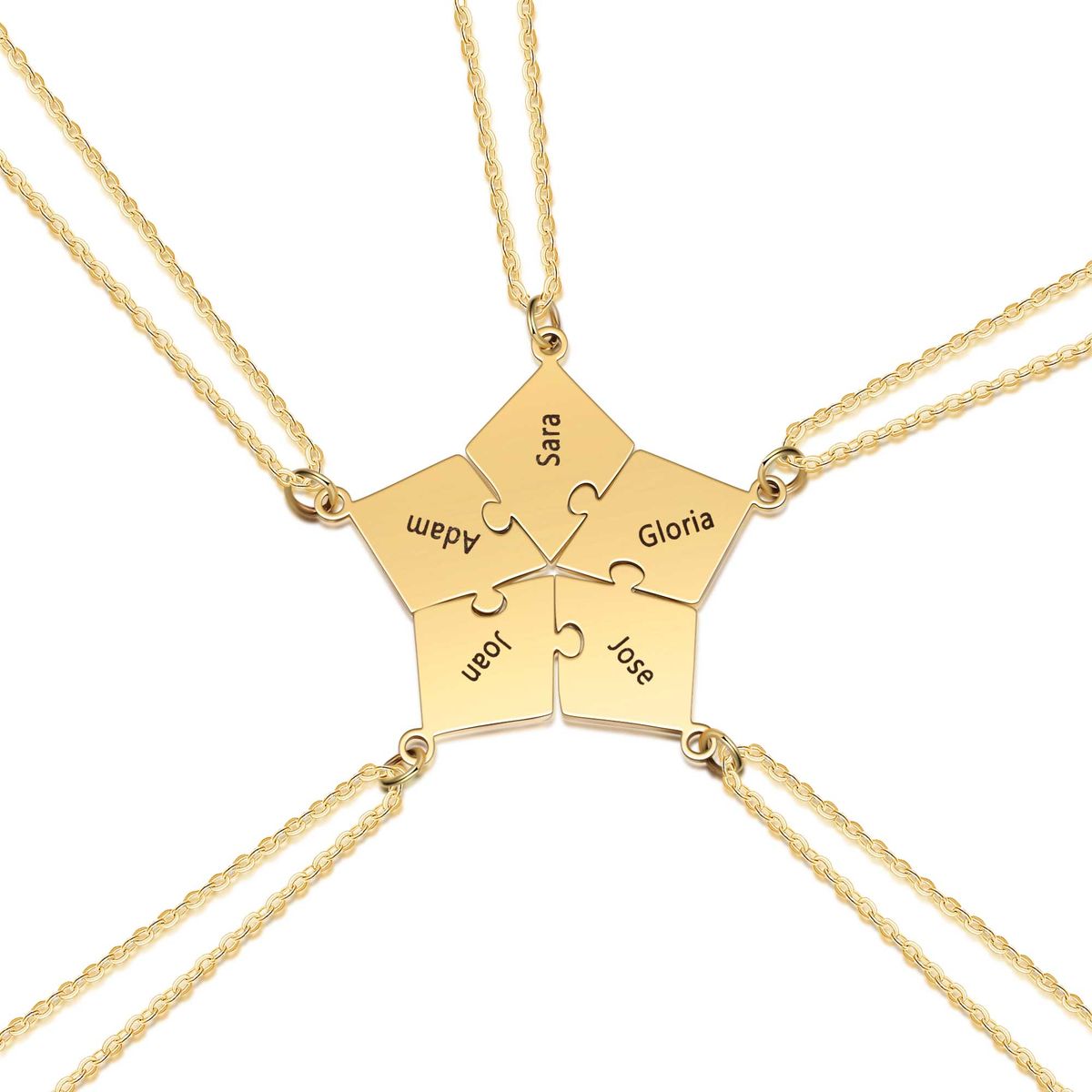 A delicate gold five-pointed star pendant necklace resting on cream fabric, catching soft light